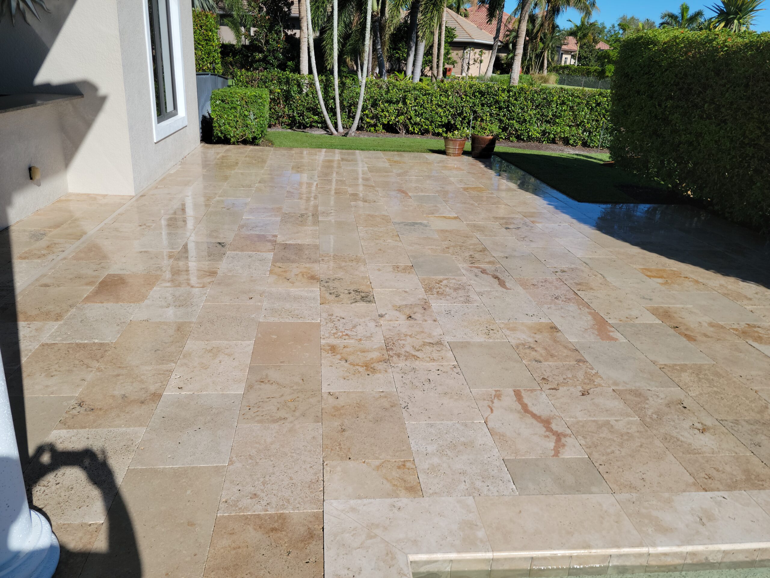 A Naples home patio revitalized by Pinnacle's expert pressure washing.