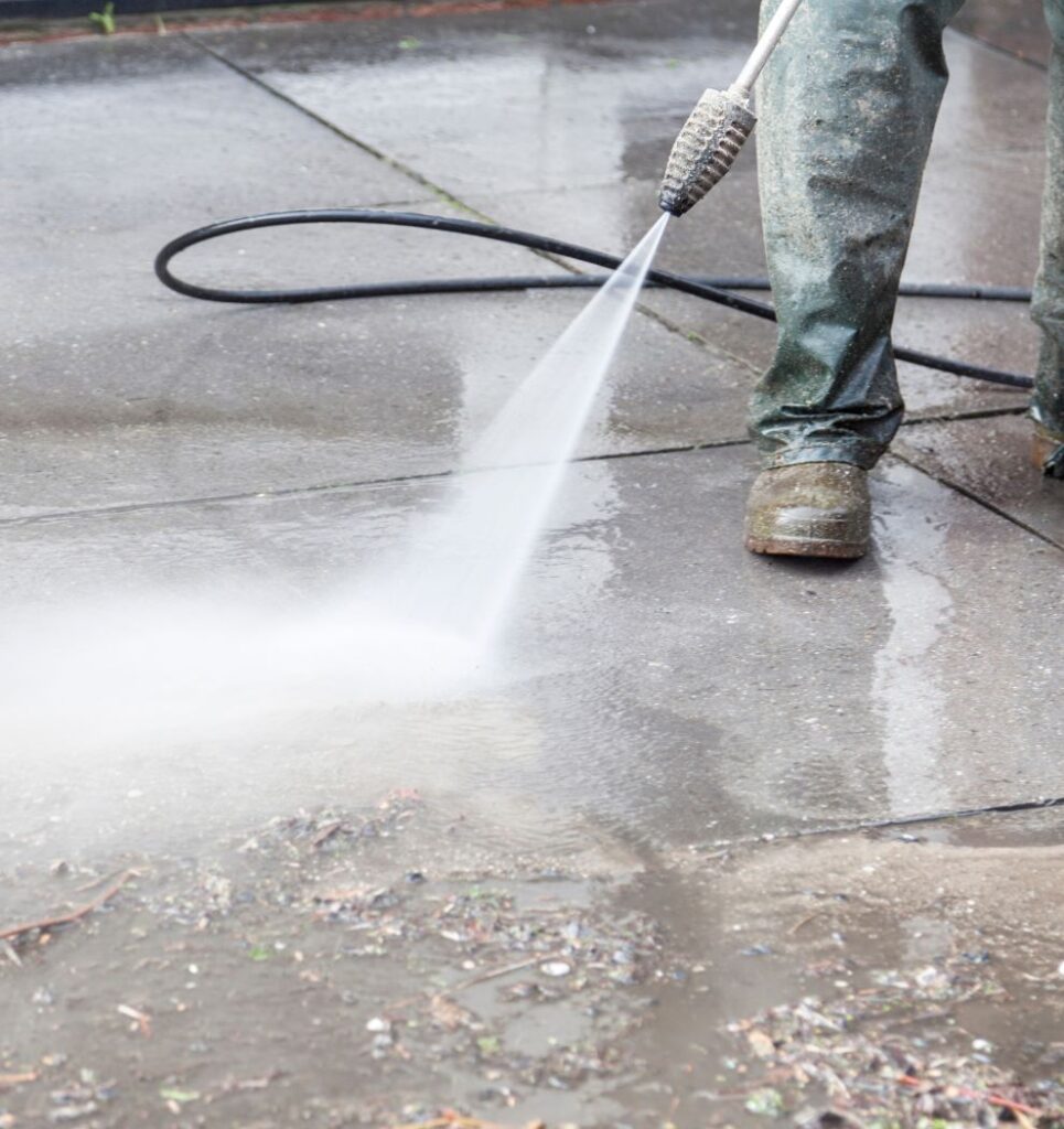 Pinnacle Pressure Cleaning and Sealing, LLC's high-pressure cleaning on concrete surfaces in Naples, FL.