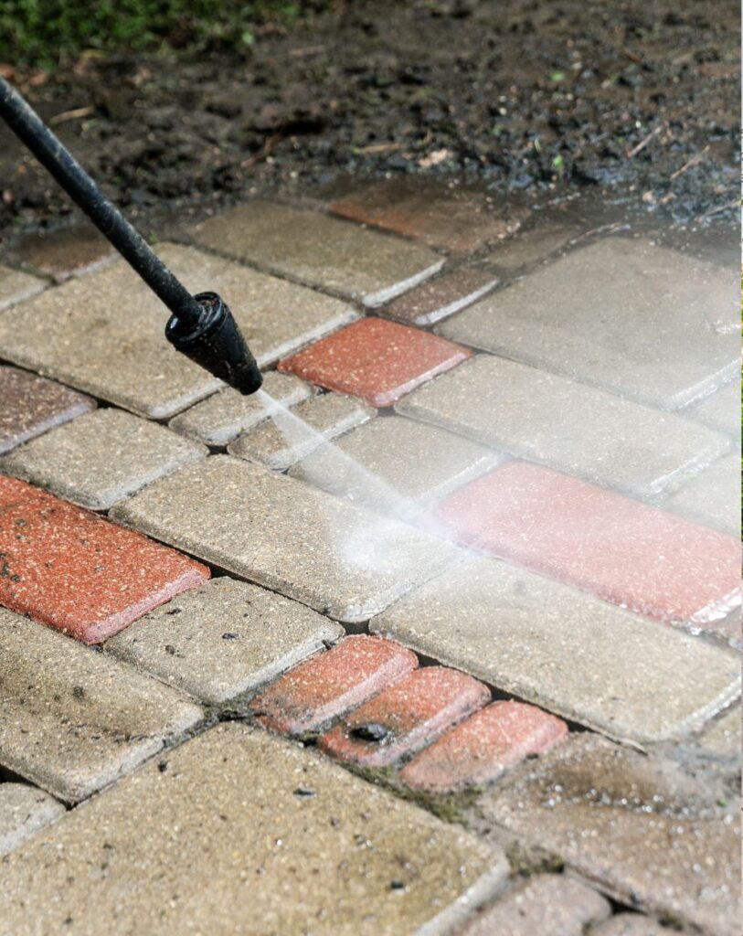 Pinnacle Pressure Cleaning and Sealing, LLC enhancing walkway bricks with pressure washing in Naples, FL.