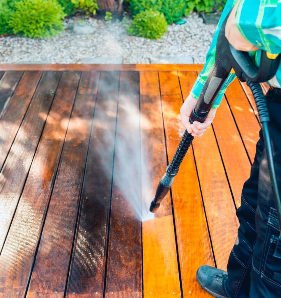 Pinnacle Pressure Cleaning and Sealing, LLC reviving a wooden deck with pressure washing in Naples, FL.